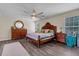A relaxing bedroom with stylish wood floors, a ceiling fan, and coordinating furnishings at 9360 S Moreto Cir, Summerville, SC 29485