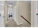 This hallway has a staircase and connects to a bedroom at 9360 S Moreto Cir, Summerville, SC 29485