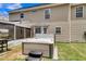 Backyard hot tub adjacent to a screened-in porch, great for entertaining and relaxation at 9360 S Moreto Cir, Summerville, SC 29485