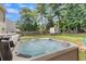 Inviting hot tub with a lush green backdrop, promising relaxation and tranquility at 9360 S Moreto Cir, Summerville, SC 29485