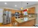 Modern kitchen featuring stainless steel appliances, granite countertops, and a breakfast bar area at 9360 S Moreto Cir, Summerville, SC 29485