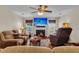 Relaxing living room featuring a fireplace and comfortable reclining sofa and chair at 9360 S Moreto Cir, Summerville, SC 29485