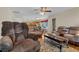 Wide view of the open living space with dining and kitchen in the background at 9360 S Moreto Cir, Summerville, SC 29485