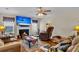 Relaxing living room featuring a cozy fireplace and comfortable seating at 9360 S Moreto Cir, Summerville, SC 29485