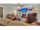 Relaxing living room featuring a cozy fireplace and comfortable seating arrangements at 9360 S Moreto Cir, Summerville, SC 29485
