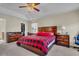 Spacious main bedroom featuring a trey ceiling, ceiling fan, walk-in closet, and an ensuite bathroom at 9360 S Moreto Cir, Summerville, SC 29485