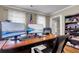 Spacious office area with multiple monitors, a large desk, and plenty of storage at 9360 S Moreto Cir, Summerville, SC 29485