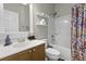 Clean bathroom featuring a single vanity, bathtub with shower, and decorative shower curtain enhancing the room's appeal at 9400 Divot Ln, Summerville, SC 29485