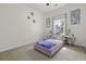 Cozy bedroom featuring a window, and side tables adorned with decorative items creating a relaxing ambiance at 9400 Divot Ln, Summerville, SC 29485