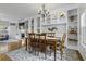 Formal dining room featuring a wooden table, decorative chandelier, and built-in shelving at 9400 Divot Ln, Summerville, SC 29485