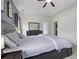 Bright and airy main bedroom showcasing neutral tones, a ceiling fan, and generous natural light at 9400 Divot Ln, Summerville, SC 29485