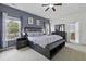 Spacious main bedroom with tray ceiling, complemented by natural light and modern furnishings at 9400 Divot Ln, Summerville, SC 29485