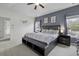 A serene main bedroom featuring a ceiling fan, tasteful decor, and abundant natural light at 9400 Divot Ln, Summerville, SC 29485