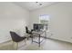 Bright home office with desk, computer, and an ergonomic chair providing a functional and comfortable workspace at 9400 Divot Ln, Summerville, SC 29485