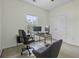 Functional home office with dual monitors, desk, and comfortable seating, perfect for productivity and focus at 9400 Divot Ln, Summerville, SC 29485