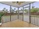 Charming screened porch featuring brick flooring, and views of the fenced backyard creating a relaxing outdoor space at 9400 Divot Ln, Summerville, SC 29485