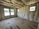 Bedroom under construction with insulation and windows creating a naturally bright space at 947 Dusk Dr, Summerville, SC 29486