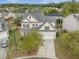 Expansive aerial view of a charming two-story home featuring a well-manicured lawn in a serene neighborhood at 9684 Pebble Creek Blvd, Summerville, SC 29485