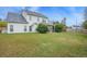 Spacious backyard with well-maintained lawn, mature landscaping, and a screened porch at 9684 Pebble Creek Blvd, Summerville, SC 29485