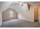 Spacious carpeted bedroom featuring a ceiling fan and a closet for ample storage space at 9684 Pebble Creek Blvd, Summerville, SC 29485
