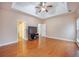 Large bedroom with a ceiling fan and hardwood floors, showcasing ample space and two doorways at 9684 Pebble Creek Blvd, Summerville, SC 29485