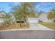 Well-maintained single-Gathering home with a two-car garage, driveway, and landscaped front yard at 9684 Pebble Creek Blvd, Summerville, SC 29485