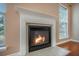 Close up of a cozy fireplace with a decorative mantle and tile surround, adding charm to the living space at 9684 Pebble Creek Blvd, Summerville, SC 29485