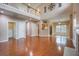 Open-concept living space with hardwood floors, a fireplace, and a view of the upstairs loft area at 9684 Pebble Creek Blvd, Summerville, SC 29485