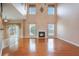 Spacious living room with hardwood floors, fireplace and soaring ceilings, providing an inviting atmosphere at 9684 Pebble Creek Blvd, Summerville, SC 29485