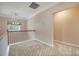 Cozy, carpeted loft with a chandelier and natural light, creating a versatile living space at 9684 Pebble Creek Blvd, Summerville, SC 29485