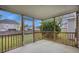 Relaxing screened porch with wood railings, offering a serene outdoor living space at 9684 Pebble Creek Blvd, Summerville, SC 29485