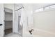 White bathroom featuring a soaking tub and a walk-in shower with white and grey marble at 102 Kapalua Run, Summerville, SC 29483