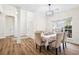 Formal dining room with ample natural light, classic decor, and convenient access to entryway at 102 Kapalua Run, Summerville, SC 29483
