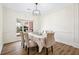 Elegant dining room with wainscoting, natural light, and seating for six, perfect for gatherings at 102 Kapalua Run, Summerville, SC 29483