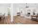 Open concept living room showcasing hardwood floors, natural light, and inviting layout at 102 Kapalua Run, Summerville, SC 29483