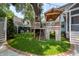 Lush backyard featuring a playhouse, manicured lawn, and brick-lined patio at 1021 Barfield St, Charleston, SC 29492