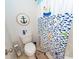 Nautical themed bathroom with a fish patterned shower curtain and a decorative anchor at 1021 Barfield St, Charleston, SC 29492