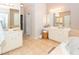 Large primary bathroom features a soaking tub, walk-in shower, and double vanity at 1021 Barfield St, Charleston, SC 29492