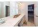 Well-lit bathroom featuring a double sink vanity and glimpse of a bunkbed bedroom at 1021 Barfield St, Charleston, SC 29492