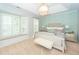 Bedroom with a tray ceiling, decorative lighting, patterned accent wall, and window seating at 1021 Barfield St, Charleston, SC 29492