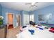 Comfortable bedroom featuring carpet flooring, ceiling fan, and natural light at 1021 Barfield St, Charleston, SC 29492