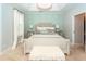 Bedroom with a tray ceiling, decorative lighting, patterned accent wall, and plush white rug at 1021 Barfield St, Charleston, SC 29492