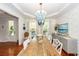 Elegant dining room featuring a striking blue chandelier and stylish coastal-inspired decor at 1021 Barfield St, Charleston, SC 29492