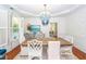 Elegant dining room featuring a striking blue chandelier and stylish coastal-inspired decor at 1021 Barfield St, Charleston, SC 29492