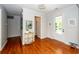 Entryway with wood flooring, console table, front door, and view of a room with a water view at 1021 Barfield St, Charleston, SC 29492