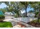 Beautiful home featuring a private driveway, garage, picket fence, and mature trees at 1021 Barfield St, Charleston, SC 29492