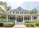 Charming two-story home boasting a welcoming porch and a classic, symmetrical design at 1021 Barfield St, Charleston, SC 29492