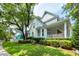 Charming two-story home with mature landscaping and a cozy side porch at 1021 Barfield St, Charleston, SC 29492