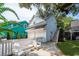 Detached two-car garage with stairs leading to a loft above, adjacent to a fenced-in yard at 1021 Barfield St, Charleston, SC 29492