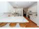 Modern kitchen features white cabinets, stainless steel appliances, and a large island with counter seating at 1021 Barfield St, Charleston, SC 29492